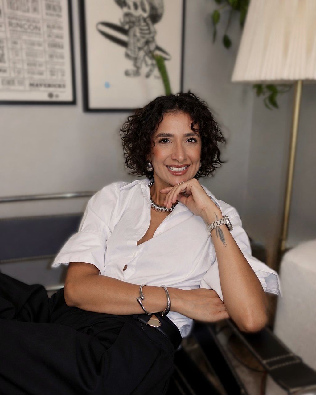 Maybelline Ballesteros Cunanan smiling, leaning back in a chrome and leather chair