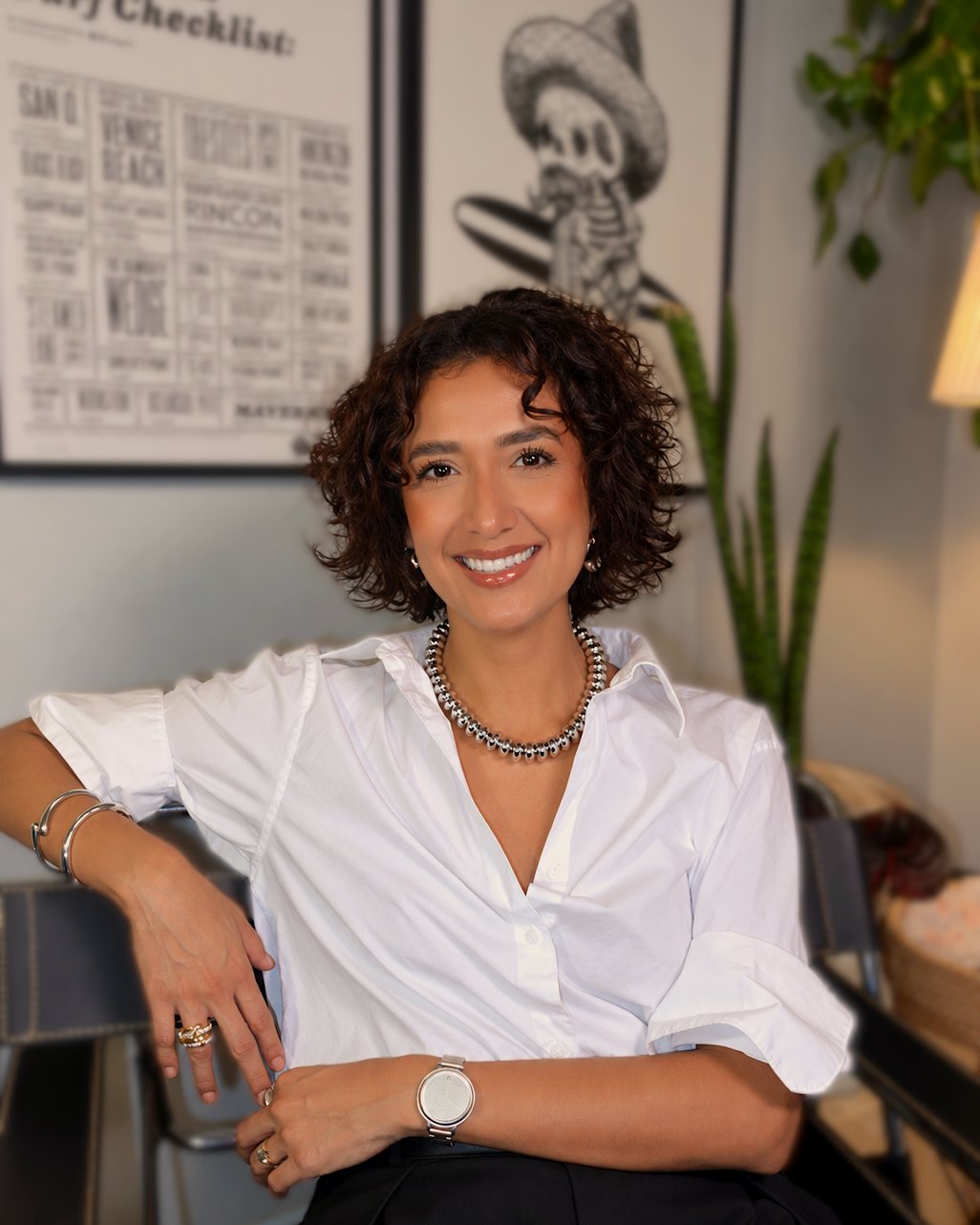 Maybelline Ballesteros Cunanan, founder of If I May Studio, seated in a white shirt in her Long Beach studio